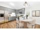 Charming eat-in kitchen featuring gray cabinets, white countertops, stainless steel appliances, and wood-look floors at 10200 Cairnsmore Pl # 9, Mint Hill, NC 28227