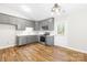 The kitchen has grey cabinets, stainless steel appliances, and ample counter space with outside access at 10200 Cairnsmore Pl # 9, Mint Hill, NC 28227