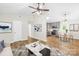 Staged living room showcasing open floor plan, modern decor, and hardwood floors at 10200 Cairnsmore Pl # 9, Mint Hill, NC 28227