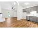 Open-concept floorplan with updated kitchen flowing into the living room, ideal for modern living at 10200 Cairnsmore Pl # 9, Mint Hill, NC 28227