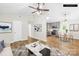 Staged living room showcasing open floor plan, modern decor, and hardwood floors at 10200 Cairnsmore Pl # 9, Mint Hill, NC 28227