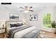 Bedroom with modern decor, light walls, ceiling fan, and natural light at 10200 Cairnsmore Pl # 9, Mint Hill, NC 28227