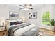 Bedroom with modern decor, light walls, ceiling fan, and natural light at 10200 Cairnsmore Pl # 9, Mint Hill, NC 28227