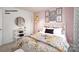 Comfortable bedroom featuring bright decor, stylish bedding, and easy access to a closet, ideal for a relaxing retreat at 1023 Hostler Ln, York, SC 29745