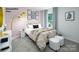 Comfortable bedroom featuring bright decor, plush bedding, and easy access to an adjoining room, ideal for a relaxing retreat at 1023 Hostler Ln, York, SC 29745
