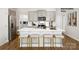 Contemporary kitchen featuring a spacious island with seating, stainless steel appliances, and sleek gray cabinets at 1023 Hostler Ln, York, SC 29745