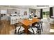 Open-concept living space featuring a kitchen with island seating, a dining area, and a cozy living room with natural light at 1023 Hostler Ln, York, SC 29745