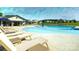 Resort-style community pool with lounge chairs, umbrellas, and a covered patio area at 1023 Hostler Ln, York, SC 29745