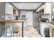 Updated kitchen with a breakfast bar, stainless steel appliances, white subway tile, and granite countertops at 1100 Mona Dr, Charlotte, NC 28206