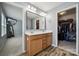 The bathroom features a double sink vanity, wood flooring, and a walk-in closet for added storage at 1180 Bannockburn Ave, Rock Hill, SC 29732