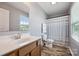 Bathroom with laminate flooring, shower curtain, and vanity at 1180 Bannockburn Ave, Rock Hill, SC 29732