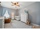 Cozy bedroom featuring a crib, rocking horse, and neutral walls for a serene atmosphere at 1180 Bannockburn Ave, Rock Hill, SC 29732