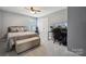 This bedroom features a queen bed, workspace and neutral decor at 1180 Bannockburn Ave, Rock Hill, SC 29732