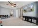 Neutral bonus room with ceiling fan, media center, and view to the main bedroom at 1180 Bannockburn Ave, Rock Hill, SC 29732