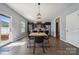 Charming dining area features modern lighting, a wooden table, and views of the backyard at 1180 Bannockburn Ave, Rock Hill, SC 29732