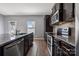 This modern kitchen features sleek stainless steel appliances, granite countertops, and ample counter space at 1180 Bannockburn Ave, Rock Hill, SC 29732