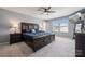 Spacious main bedroom features a ceiling fan, large windows, neutral walls and an ensuite bathroom at 1180 Bannockburn Ave, Rock Hill, SC 29732