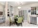 Dining area with modern light fixture and views of the living room at 11807 Hawick Valley Ln, Charlotte, NC 28277