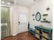 Inviting entryway featuring hardwood floors, a decorative table, and stylish accents at 11807 Hawick Valley Ln, Charlotte, NC 28277