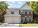 Charming two-story home with brick and siding, complemented by a manicured lawn and a two-car garage at 11807 Hawick Valley Ln, Charlotte, NC 28277
