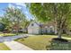 Well-maintained front yard showcasing a two-story home with a lush lawn and mature trees at 11807 Hawick Valley Ln, Charlotte, NC 28277