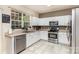 Well lit kitchen with stainless steel appliances and large window at 11807 Hawick Valley Ln, Charlotte, NC 28277