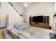 Spacious living room with high ceilings, comfortable seating, and a large entertainment center at 11807 Hawick Valley Ln, Charlotte, NC 28277