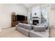 Spacious living room with a fireplace and large sectional couch at 11807 Hawick Valley Ln, Charlotte, NC 28277