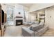 Open-concept living room featuring a fireplace and access to the dining area at 11807 Hawick Valley Ln, Charlotte, NC 28277