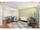 Spacious open-concept living and dining area with hardwood floors and stylish furniture at 11807 Hawick Valley Ln, Charlotte, NC 28277