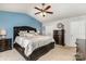 Spacious main bedroom with a sitting area and a ceiling fan at 11807 Hawick Valley Ln, Charlotte, NC 28277