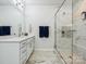 Modern bathroom featuring a marble shower and flooring, vanity with white cabinets at 119 Berkeley Ave # A, Mooresville, NC 28117