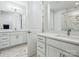 Elegant bathroom featuring double sinks, marble floors and a glass shower at 119 Berkeley Ave # A, Mooresville, NC 28117