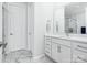 Contemporary bathroom featuring stylish vanity, marble floors, and glass shower at 119 Berkeley Ave # A, Mooresville, NC 28117
