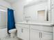 Contemporary bathroom featuring stylish vanity and a shower with blue curtain at 119 Berkeley Ave # A, Mooresville, NC 28117
