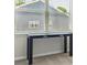 Console table in a neutral-toned room with a window and carpet flooring at 119 Berkeley Ave # A, Mooresville, NC 28117