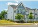 Home exterior features a blue accent wall, manicured landscaping, and a welcoming front porch at 119 Berkeley Ave # A, Mooresville, NC 28117