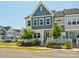Charming home exterior features a blue accent wall, manicured landscaping, and a welcoming front porch at 119 Berkeley Ave # A, Mooresville, NC 28117