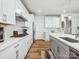 Modern kitchen with white cabinets, stainless steel appliances, and sleek countertops at 119 Berkeley Ave # A, Mooresville, NC 28117