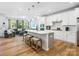 Open-concept kitchen boasts a central island, pendant lighting, and seamless flow to the living area at 119 Berkeley Ave # A, Mooresville, NC 28117