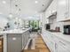 Modern kitchen with stainless appliances, a gas cooktop, and easy access to the adjacent living room at 119 Berkeley Ave # A, Mooresville, NC 28117