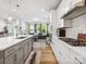 Stylish kitchen with island, cooktop, and seamless transition to the adjacent dining and living spaces at 119 Berkeley Ave # A, Mooresville, NC 28117
