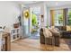 Bright and open living room with hardwood floors, a cozy seating area, and front door at 119 Berkeley Ave # A, Mooresville, NC 28117