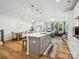 Expansive open-concept space with a kitchen island, dining area, and adjacent living area at 119 Berkeley Ave # A, Mooresville, NC 28117