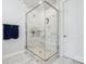 This luxurious shower features marble walls, glass doors, and a built in bench at 119 Berkeley Ave # A, Mooresville, NC 28117