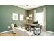 Quiet home office featuring ample natural light, sleek desk, and comfortable seating at 6320 Busch Way, Midland, NC 28107
