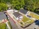 Aerial view of a renovated bungalow with new roof and nicely mowed lawn in quiet neighborhood at 1211 N Boyce St, Gastonia, NC 28052