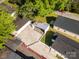 Aerial view of a home and backyard, with an open carport in a tree-filled neighborhood at 1211 N Boyce St, Gastonia, NC 28052