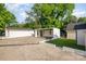 A view of the backyard, with a two car carport and one car garage, and plenty of room to play at 1211 N Boyce St, Gastonia, NC 28052
