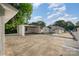 A view of the backyard, with a two car carport and one car garage. The backyard has a patio for entertaining at 1211 N Boyce St, Gastonia, NC 28052